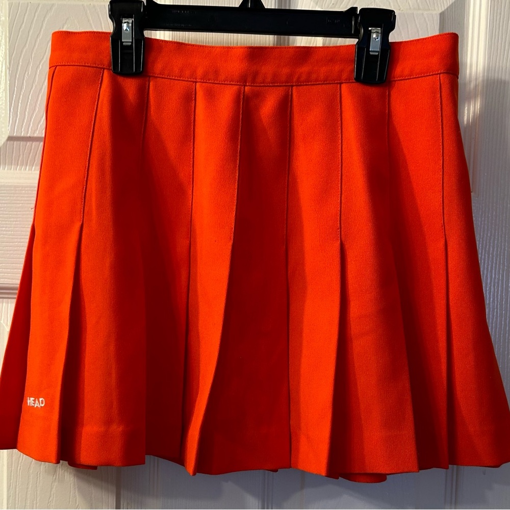 Head orange pleated tennis skirt